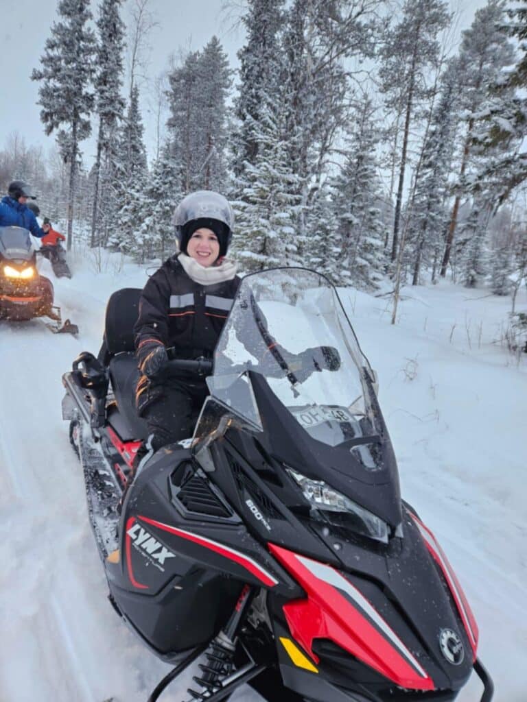 Woman on snowmobile