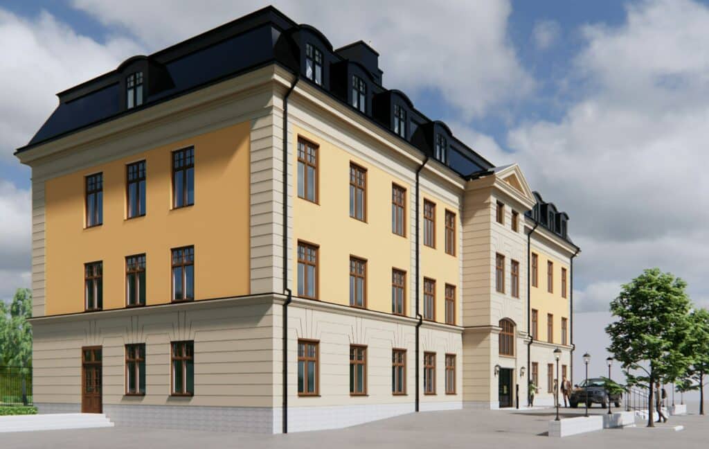 Kanslihuset in Boden - A classic building in light yellow color with dark roof and beautiful details at the windows and entrance, partly surrounded by trees and pavement.