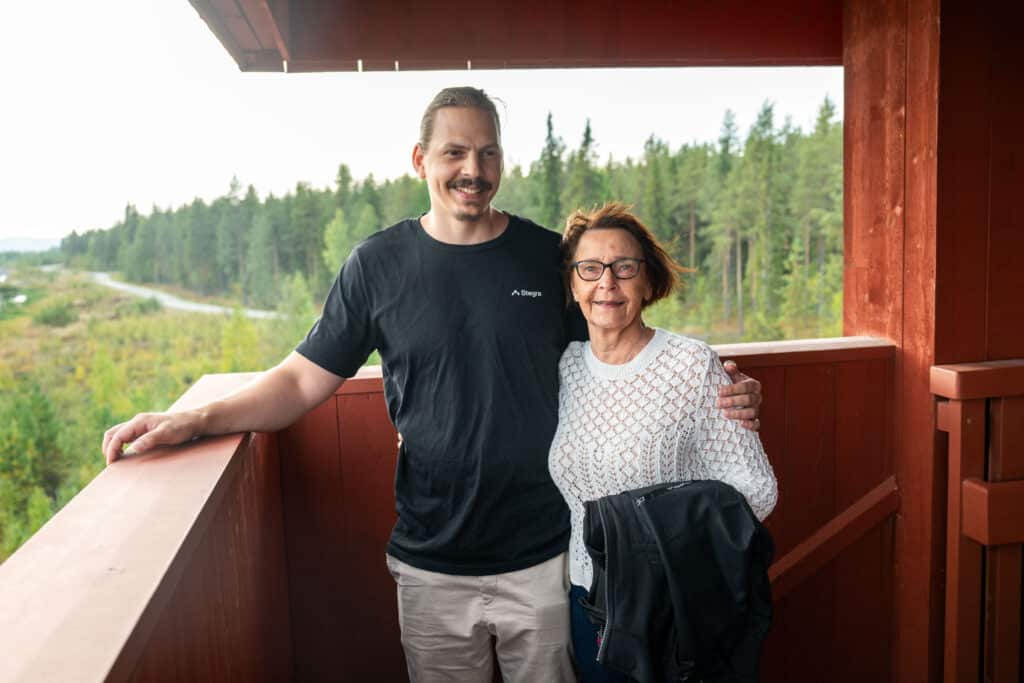 A woman and a man stand next to each other in a tower